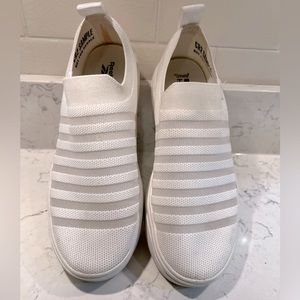 Slip on white Reebok shoes